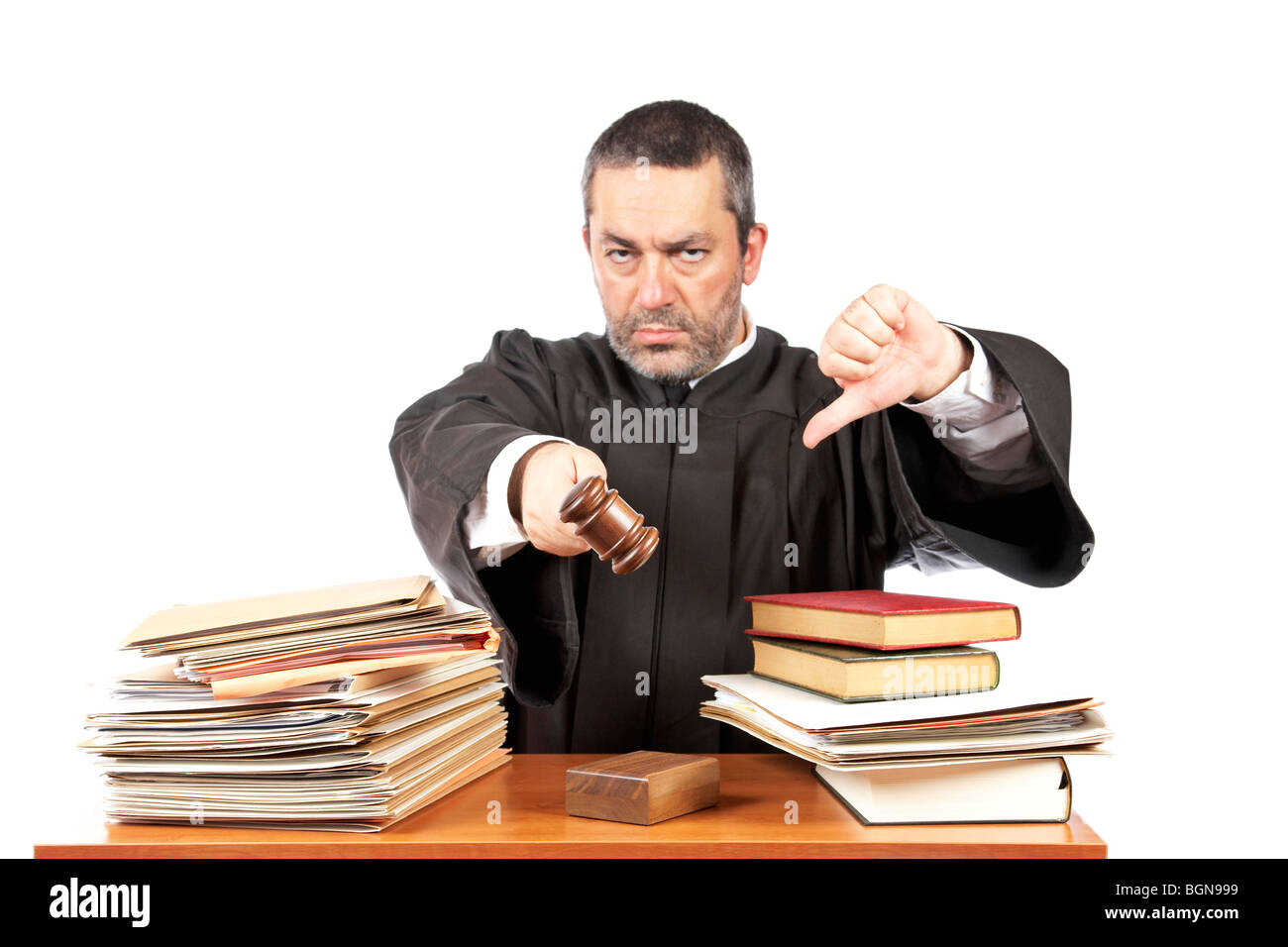 Angry male judge in a courtroom striking the gavel and pronounces