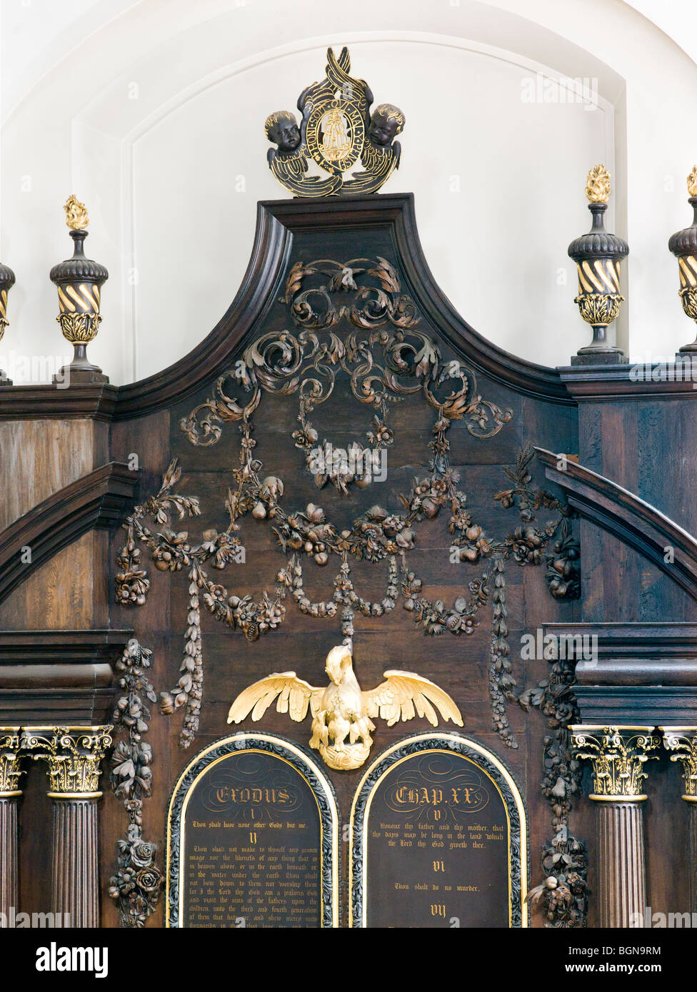 St Mary Abchurch London by  Sir Christopher Wren after Great Fire,  Grinling Gibbons carvings above altar with phoenix Stock Photo