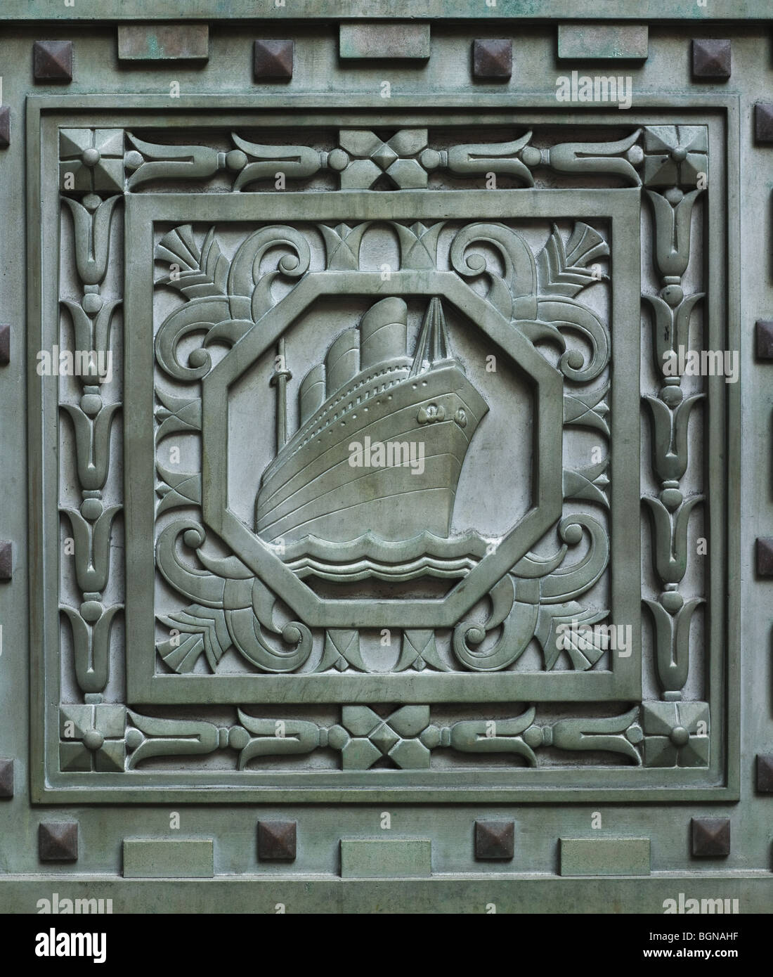 20 Exchange Place, New York, 1931 in Art Deco style.  Detail of ocean-going liner, in green metal door Stock Photo