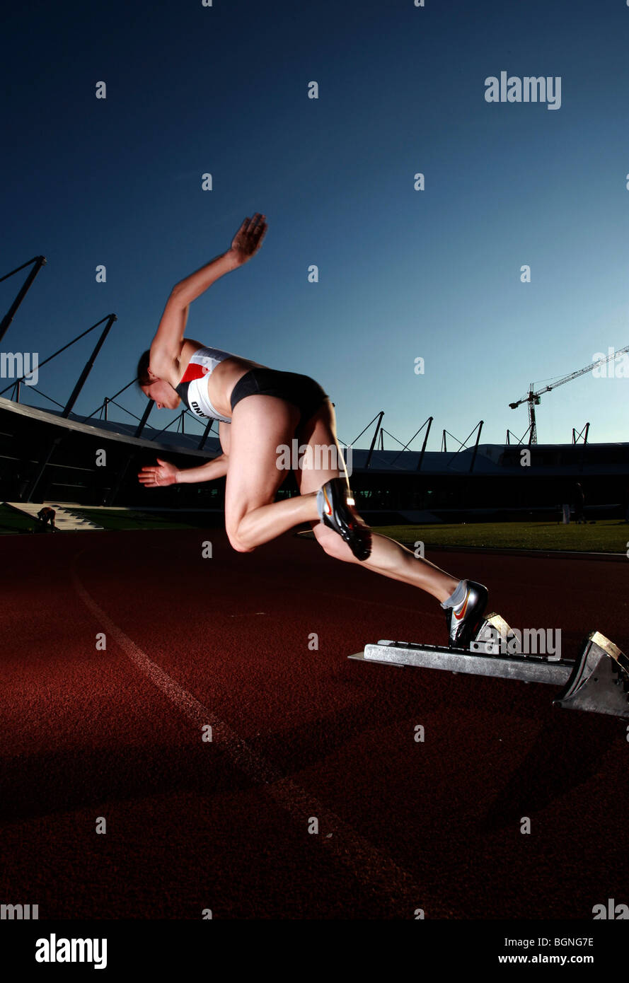 a sprinter starts from a start block Stock Photo Alamy