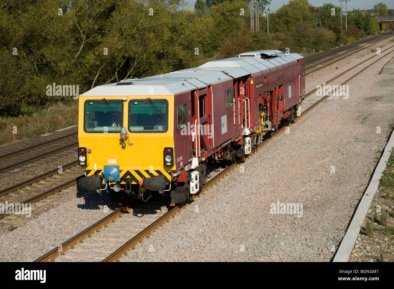 Plasser and Theurer Tamper DR73941 on a railway line in England Stock ...