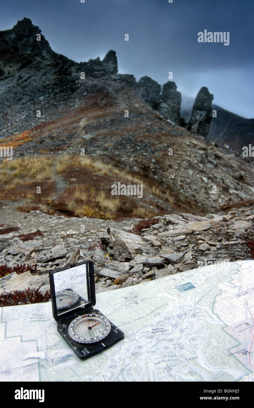 Topographic map and compass for orientation in the mountains Stock Photo