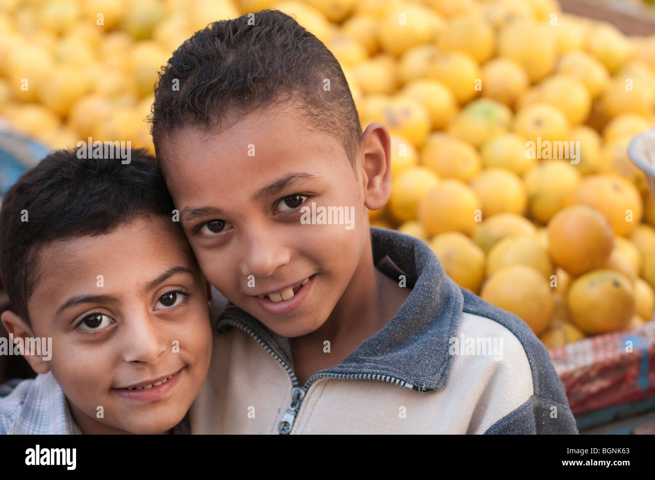 Two young boys in an Egyptian fruit and vegetable market. Stock Photo