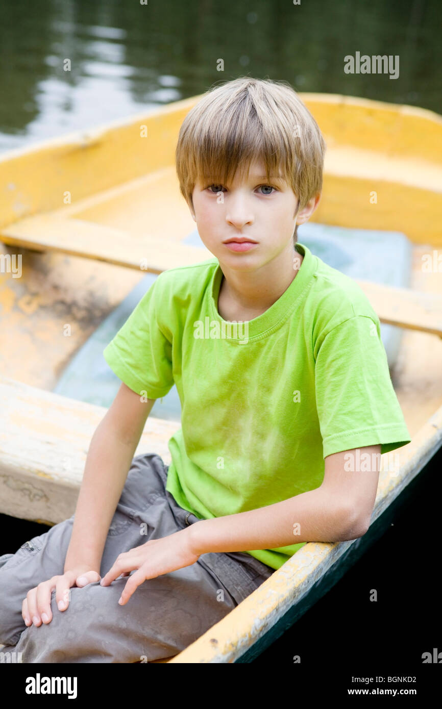 Boy sitting in boat hi-res stock photography and images - Alamy