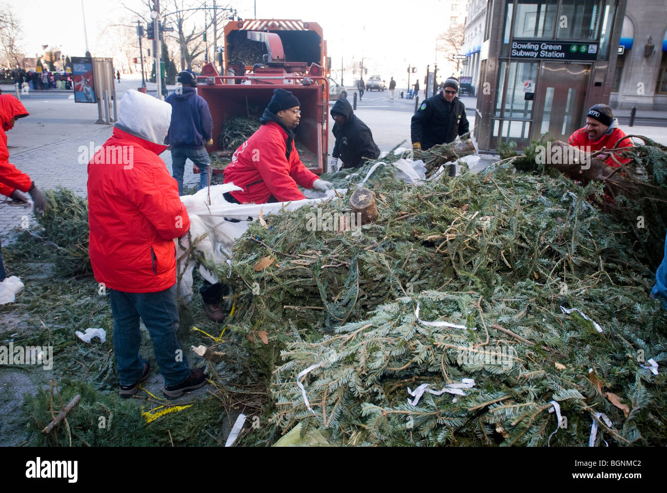 Workers for the Alliance for Downtown New York throw discarded