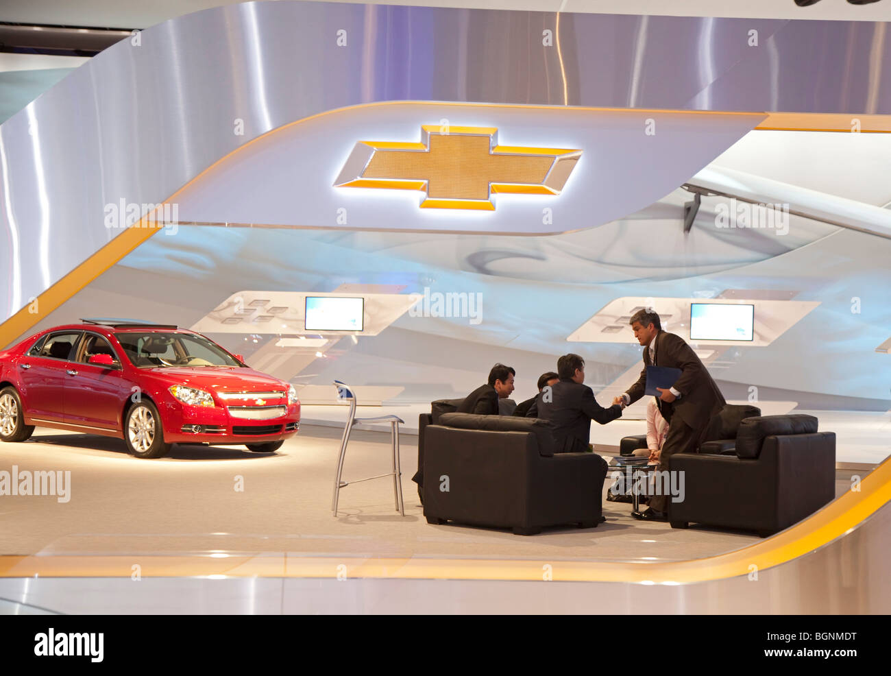 A business meeting at the Chevrolet exhibit during the North American International Auto Show. Stock Photo
