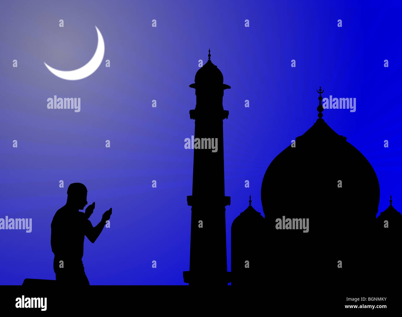 silhouette of human offering prayers at mosque Stock Photo