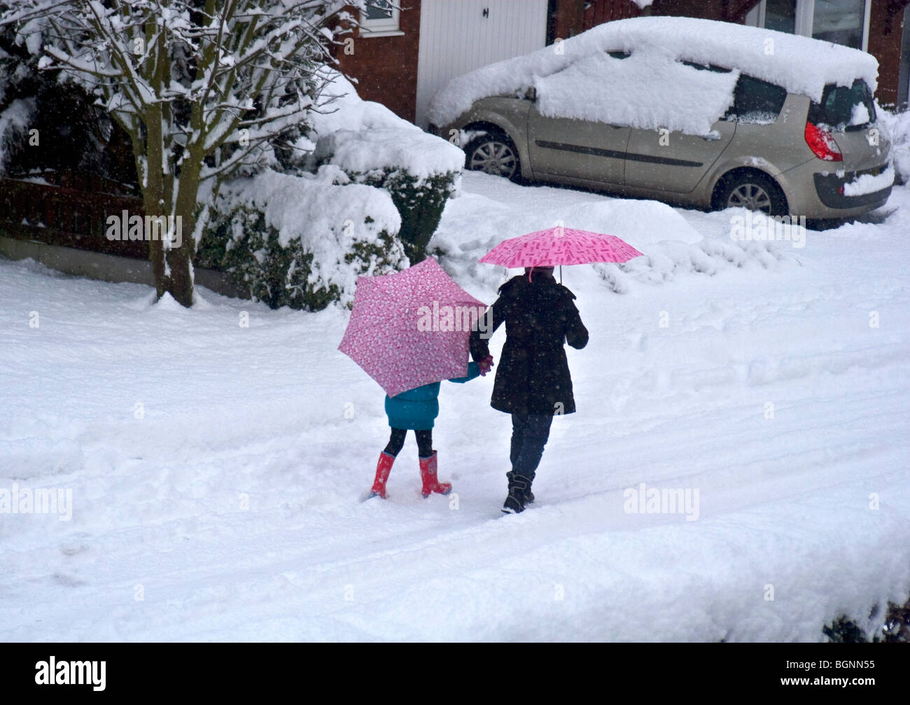 Walk to school in snowy conditions, Unsworth, Bury, Greater Manchester, UK Stock Photo