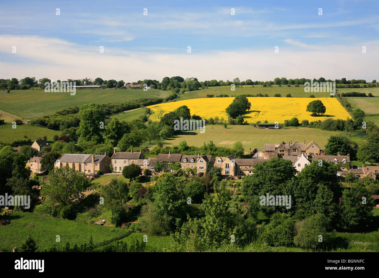 Landscape view Stone Built Cottages Naunton Village Gloucestershire Cotswolds England UK Stock Photo