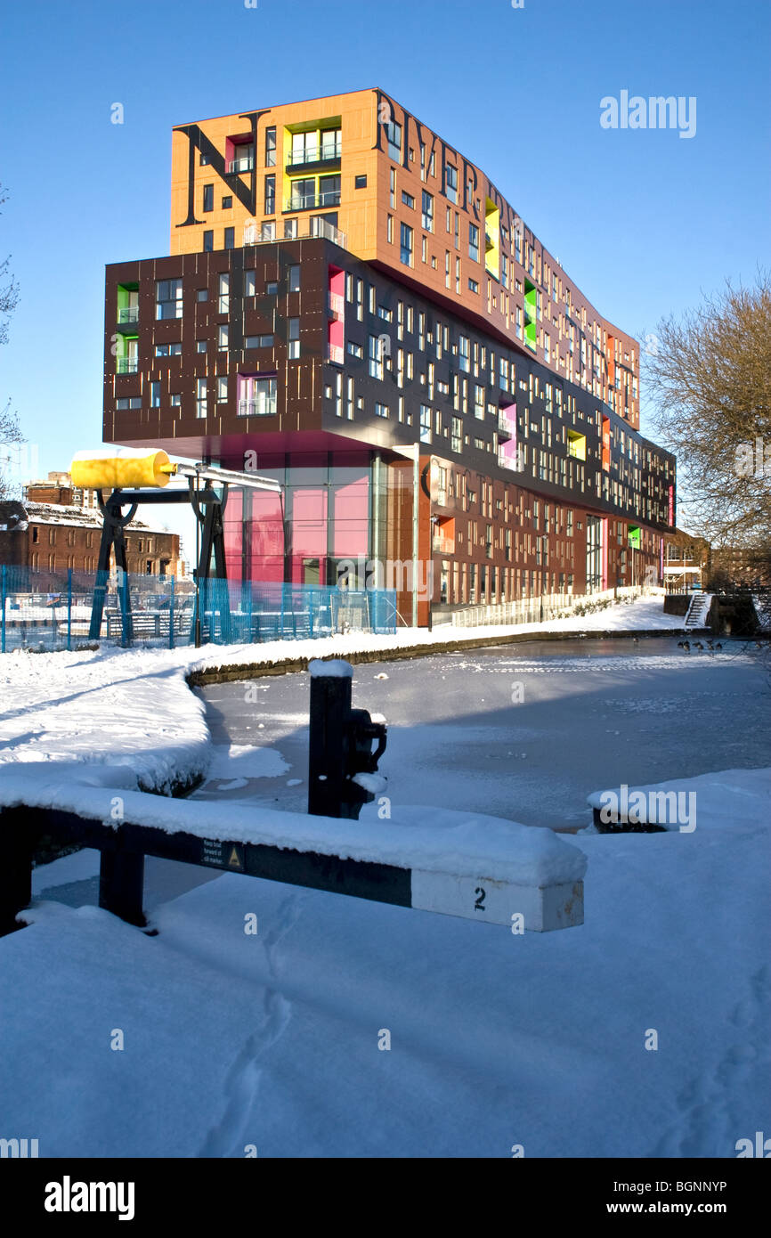Chips building, new apartments alongside Ashton Canal, New Islington, Manchester, UK Stock Photo
