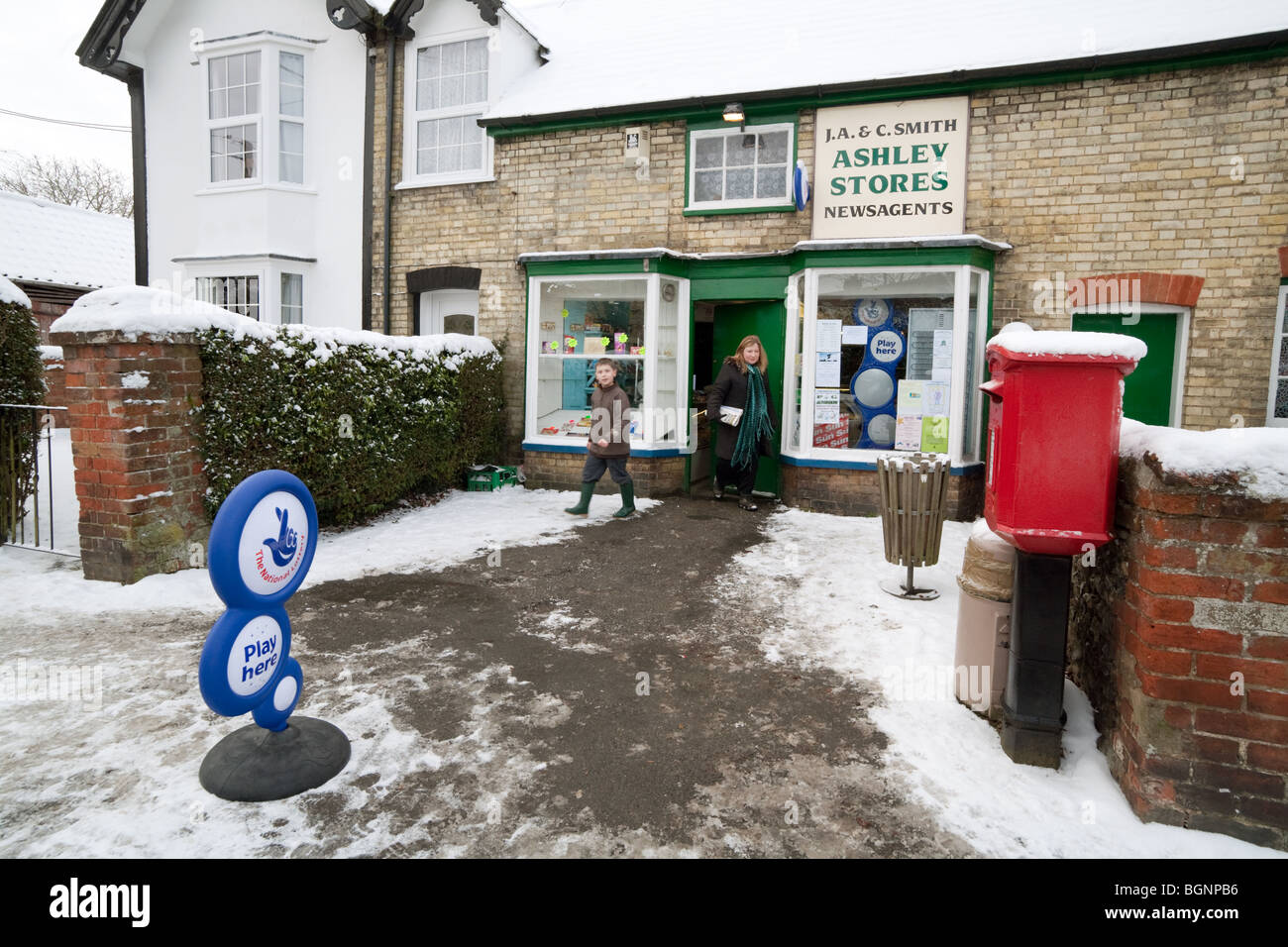 People visiting the local village store, Ashley Village near Newmarket