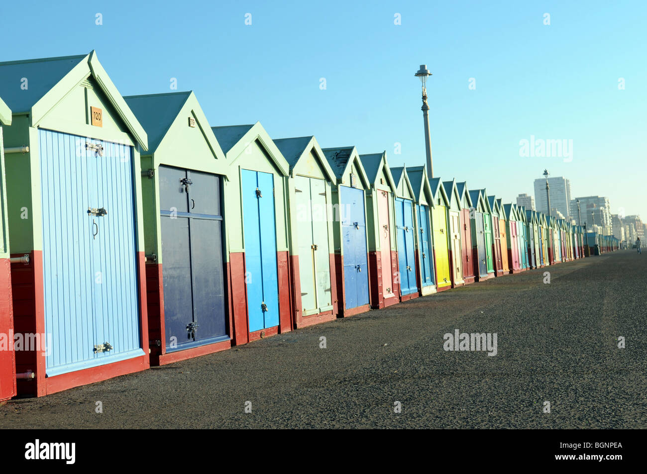 Colourful painted beach huts on the sea front at Brighton and Hove, UK. Stock Photo