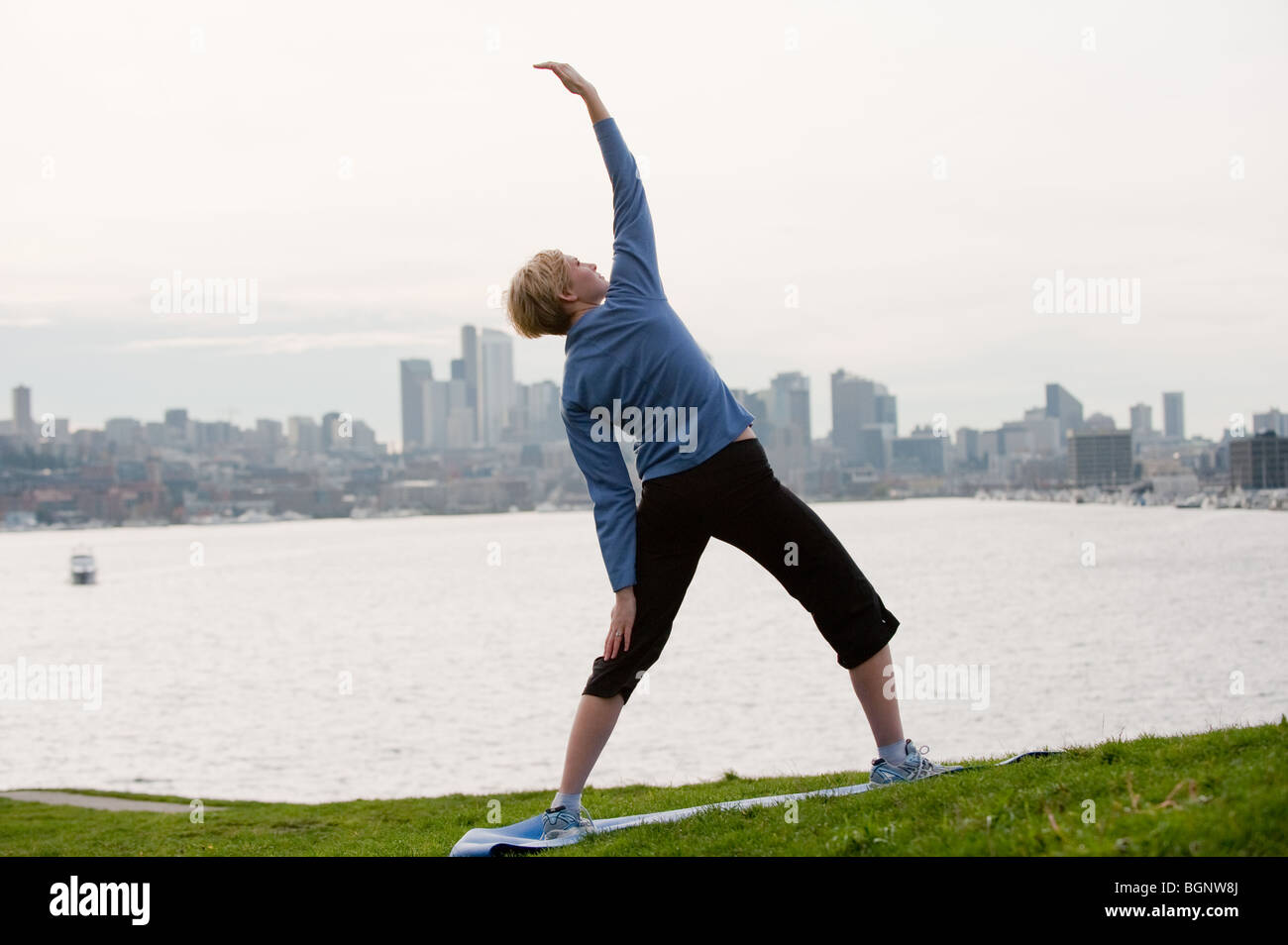 Woman practices yoga lake hi-res stock photography and images - Alamy