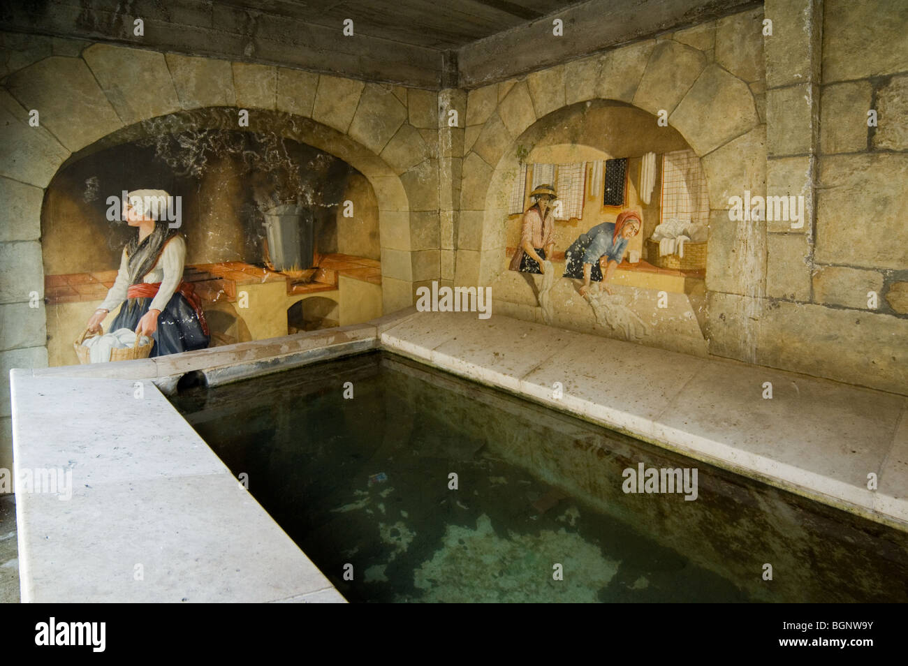 Mural showing washwomen washing in covered public lavoir at Aiguines, Provence-Alpes-Côte d'Azur, Var, Provence, France Stock Photo