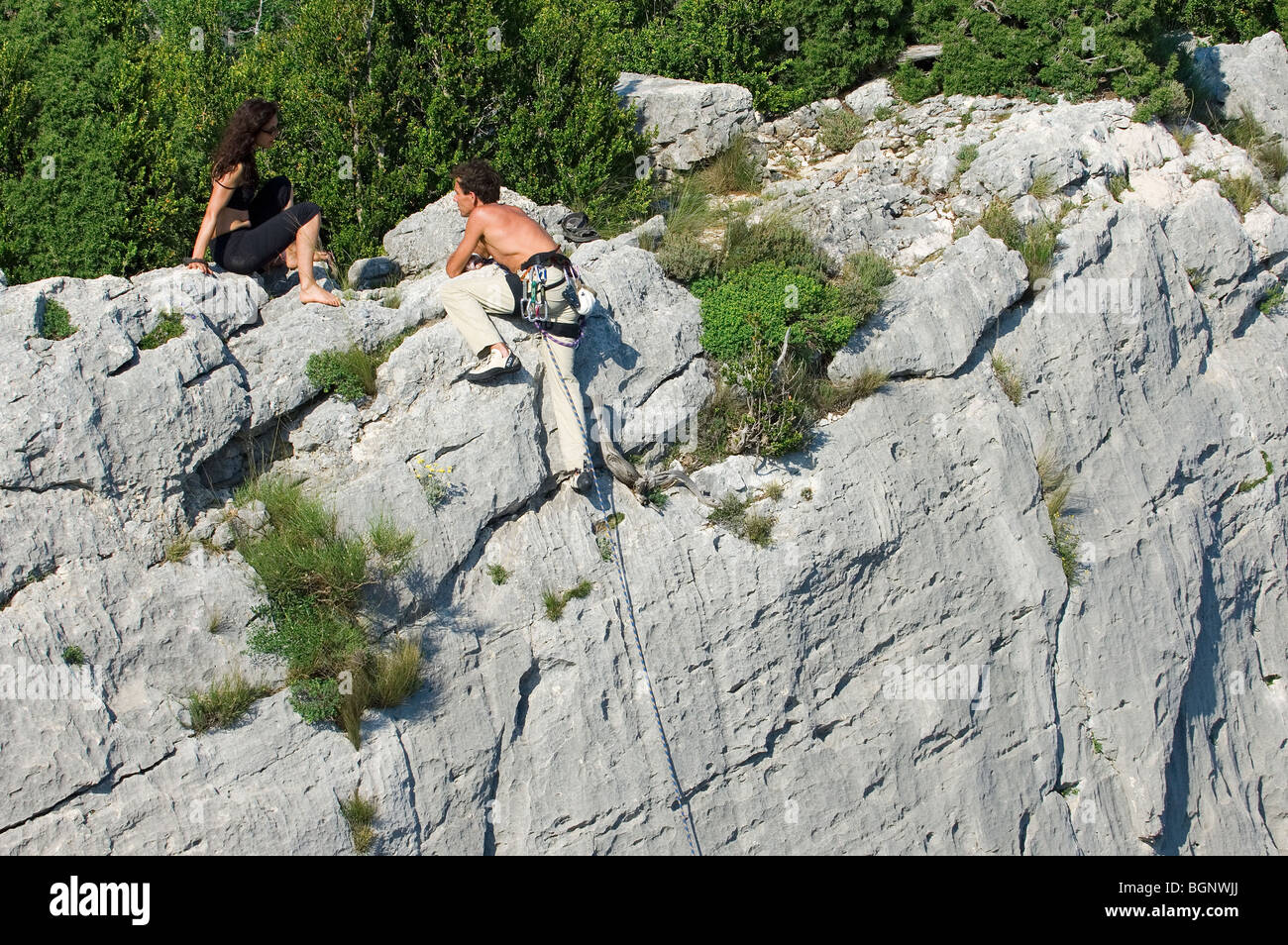 Rock climbers climbing the steep limestone cliffs in the canyon Gorges du Verdon / Verdon Gorge, Provence, France Stock Photo