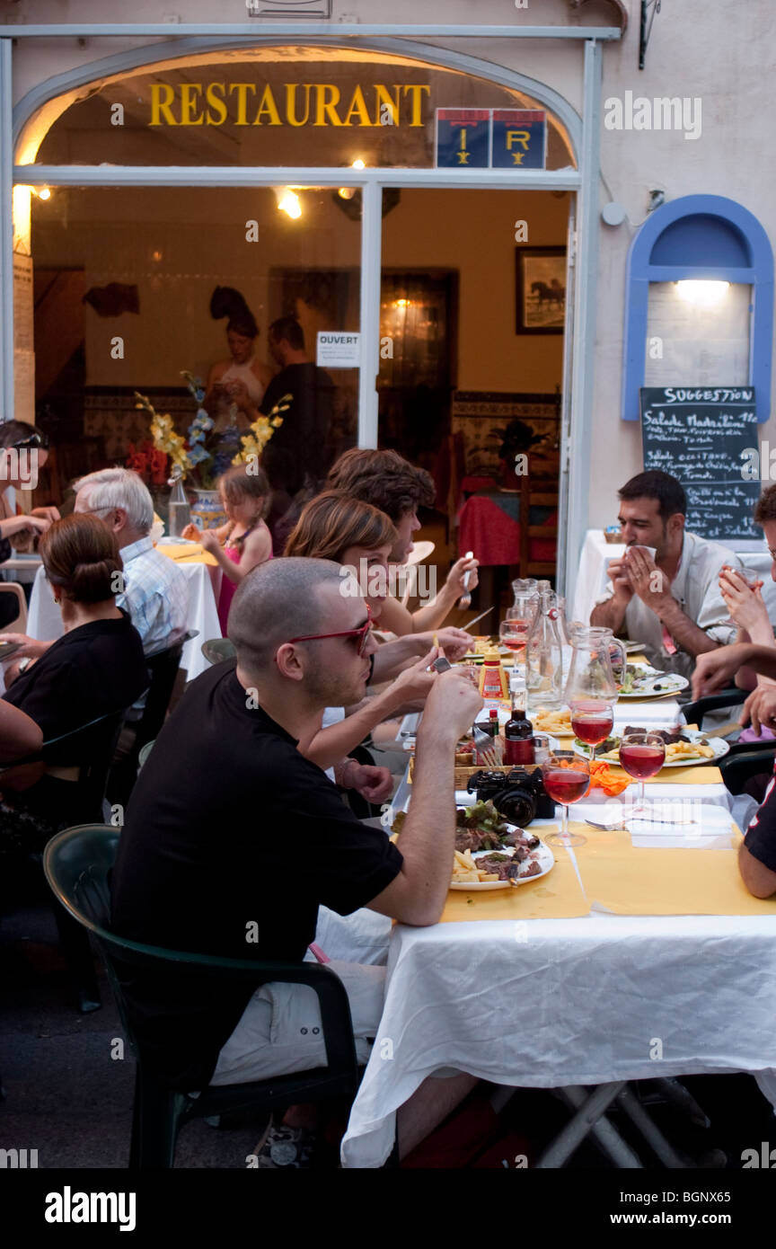 Arles, France, Crowd of People on Terrace of French Bistro Sharing Meals Eating Outside Stock Photo