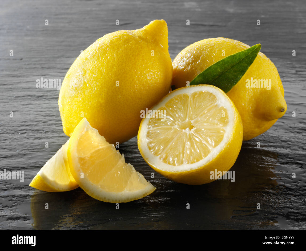 Fresh whole and cut lemons Stock Photo