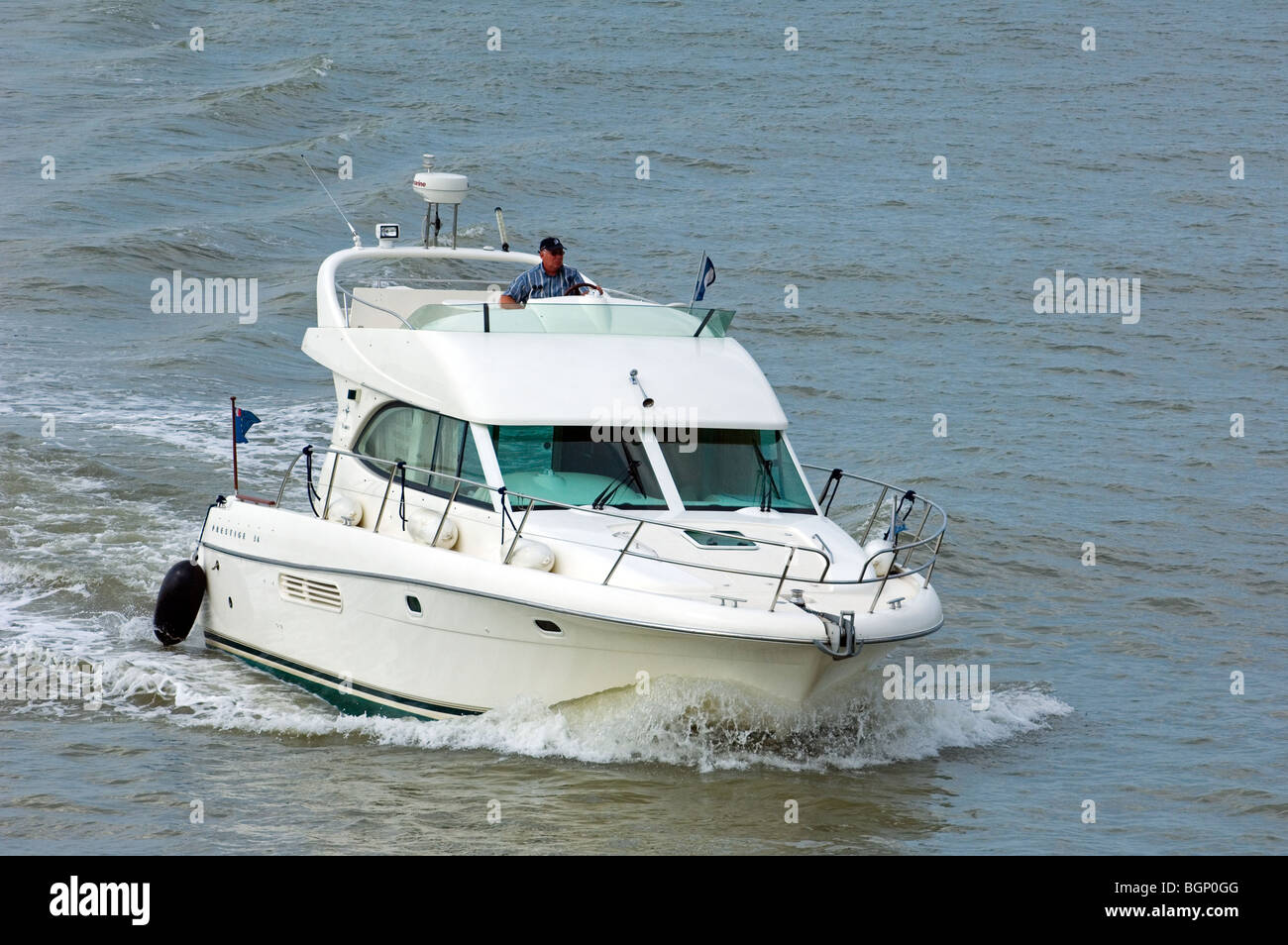 Motorboat / cabin cruiser sailing on the North Sea Stock Photo