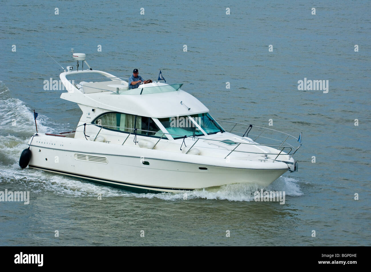 Motorboat / cabin cruiser sailing on the North Sea Stock Photo