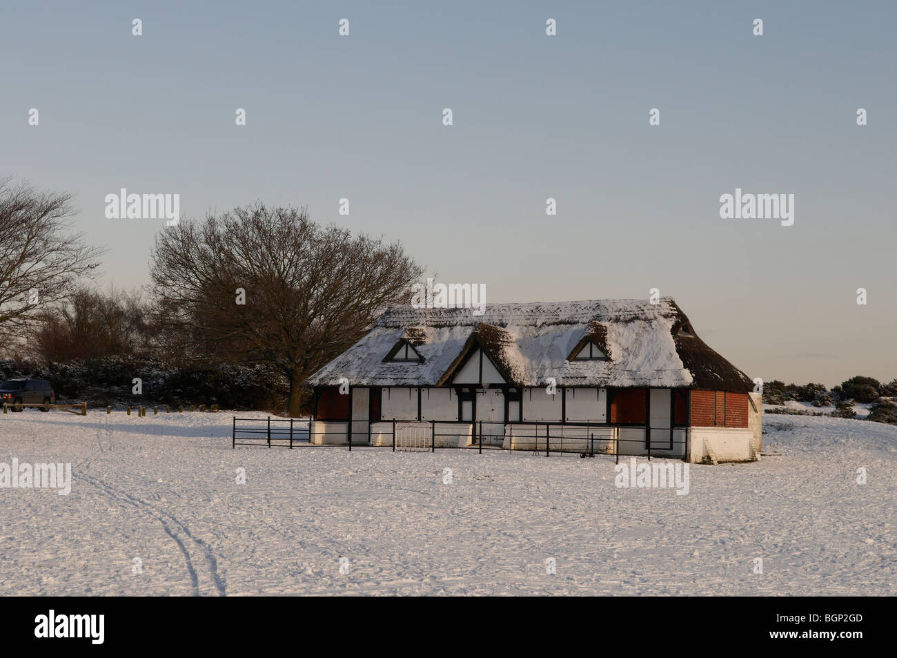 The snow covered cricket pavillion at Bolton's Bench at Lyndhurst in the New Forest National Park, Hampshire, England. Stock Photo