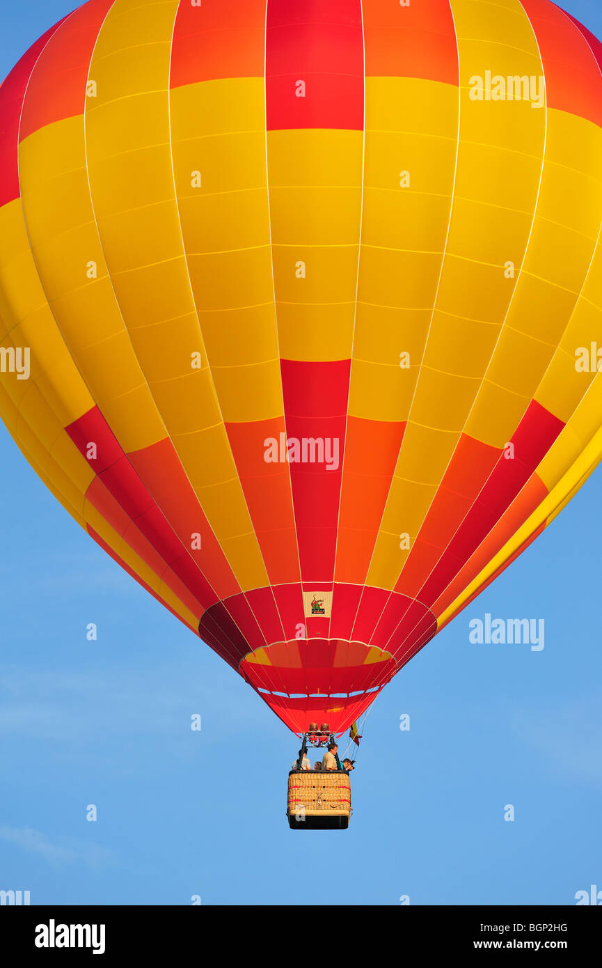 Balloonists / Aeronauts flying in hot-air balloon during ballooning meeting Stock Photo
