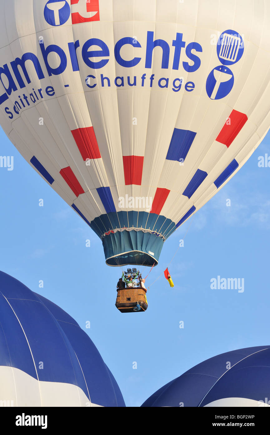 Balloonists / Aeronauts flying in hot-air balloons during ballooning meeting Stock Photo