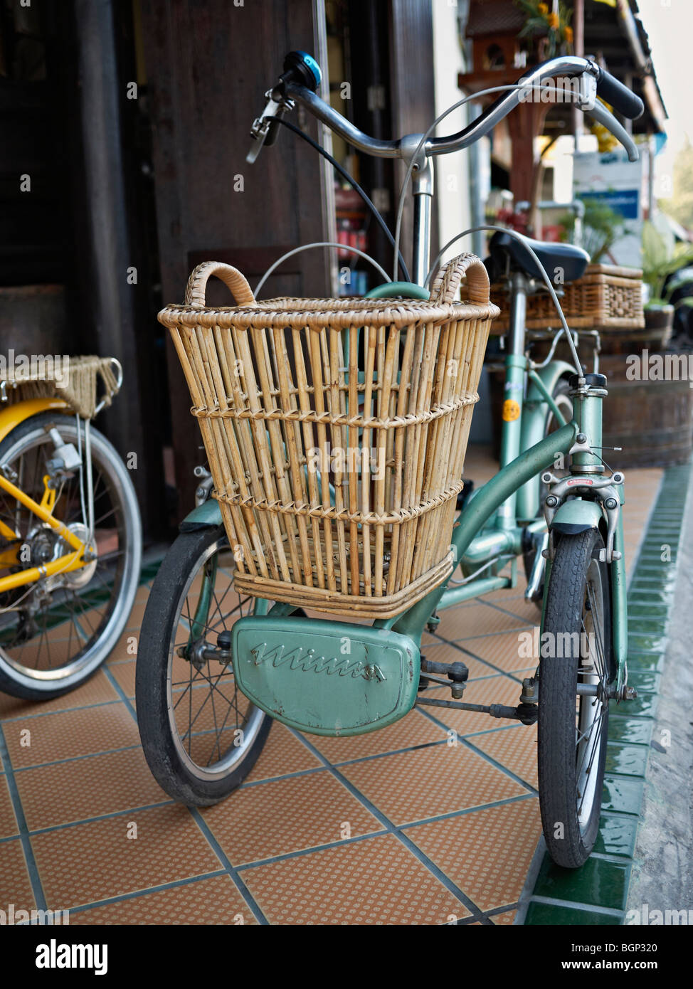 Tricycle. Rare and unusual antique Japanese tricycle with twin front wheel configuration on sale at a Thailand antique centre, S. E. Asia Stock Photo