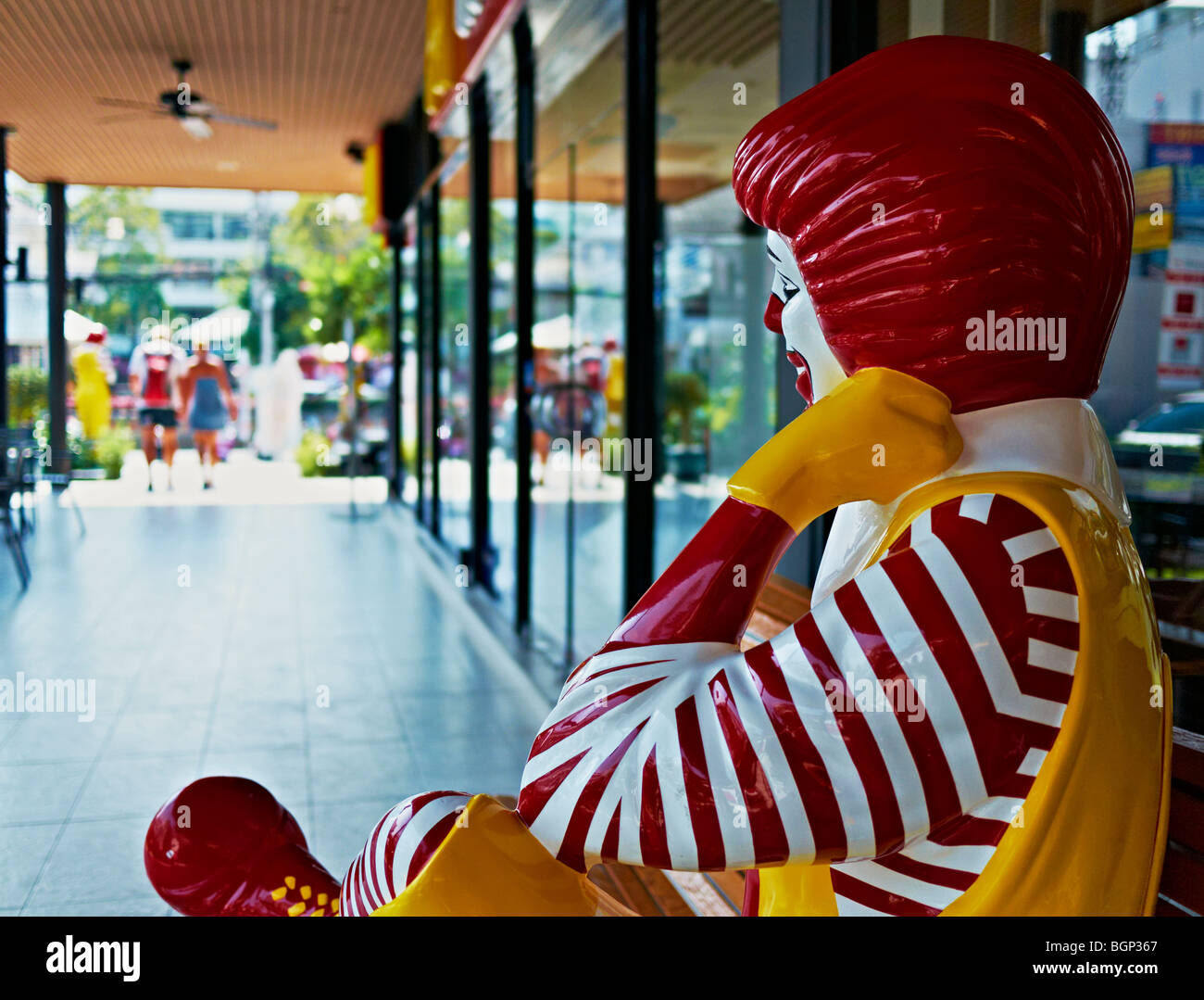 Sitting figure of Ronald McDonald in Thailand  S. E. Asia Stock Photo