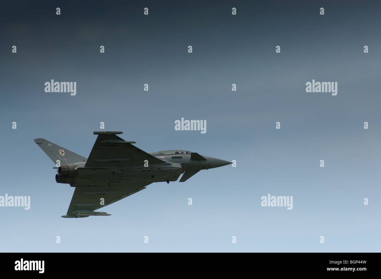 A Eurofighter Typhoon, viewed from below, flying in the sky. Stock Photo