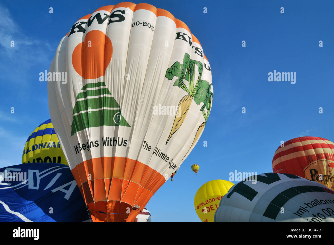 Balloonists / Aeronauts are taking off with hot-air balloons during ballooning meeting Stock Photo