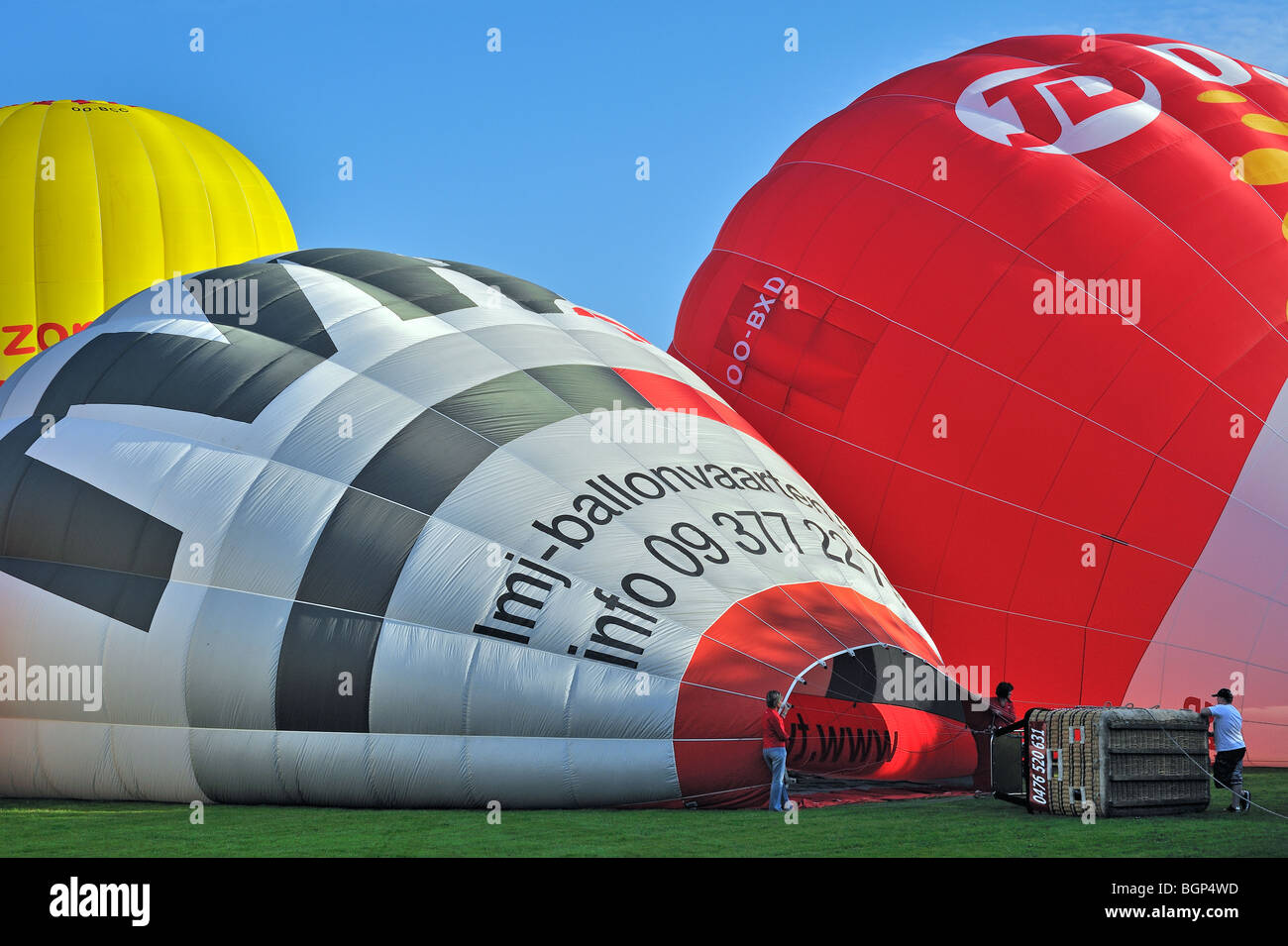Balloonists / Aeronauts are preparing hot-air balloon during ballooning meeting Stock Photo