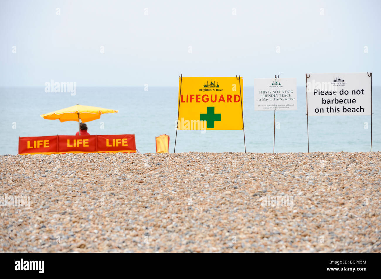 Beach safety on Brighton beach in East Sussex. A string of public safety signs welcome visitors. Picture Jim Holden. Stock Photo