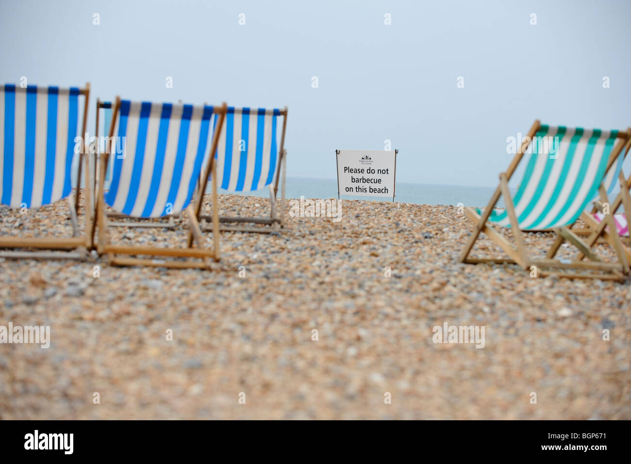 Beach safety on Brighton beach in East Sussex. A public safety sign asks 'please do not barbecue on the beach'. Stock Photo
