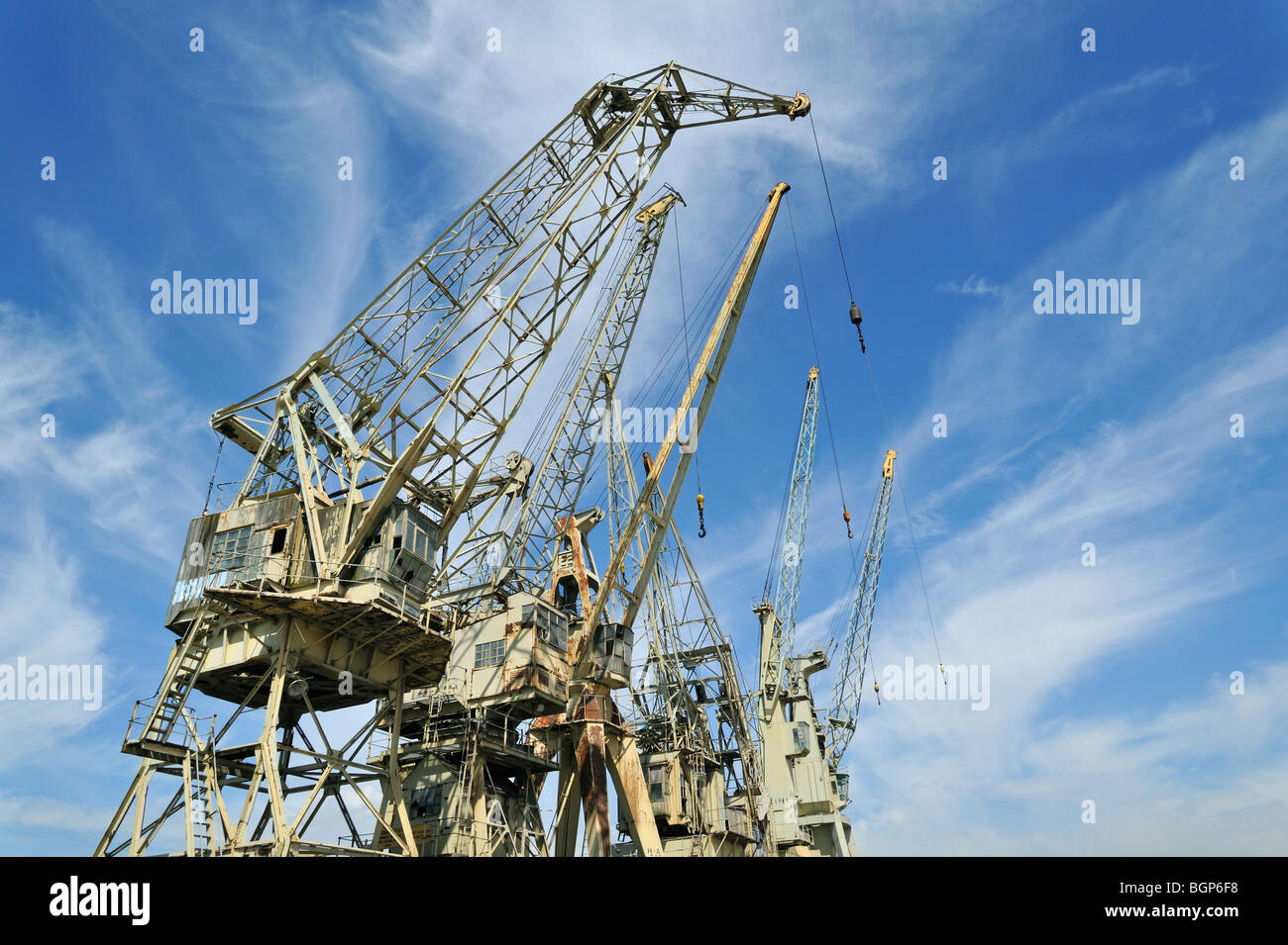 Historic dock cranes at the shipping trade museum along the docks in the port of Antwerp, Belgium Stock Photo
