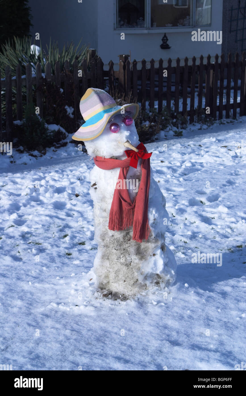 Snowman wearing scarf and hat. Stock Photo