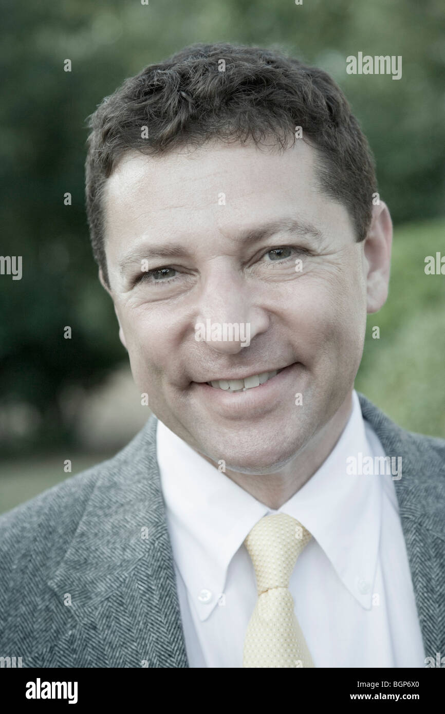 Portrait of a businessman smiling Stock Photo - Alamy