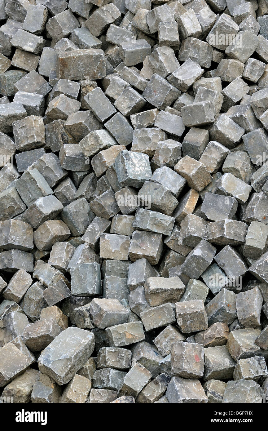 Pile of cobble stones as building material for paving road Stock Photo