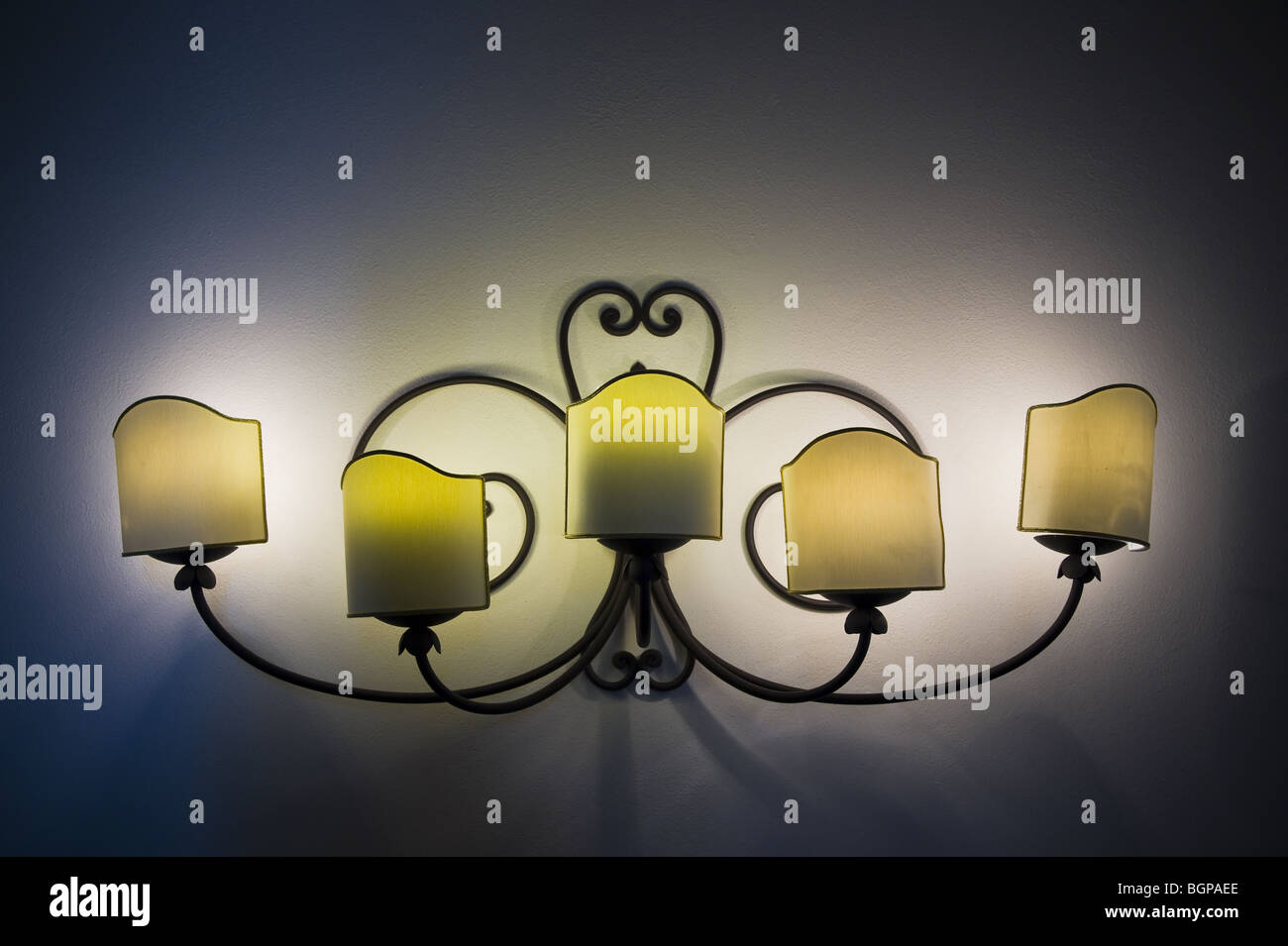 Lit wall lamp in the dark Stock Photo