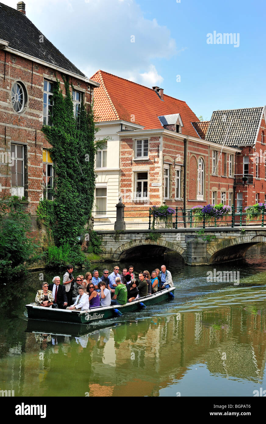 Tourists in boat under bridge over the river Little Nete, Lier, Belgium Stock Photo