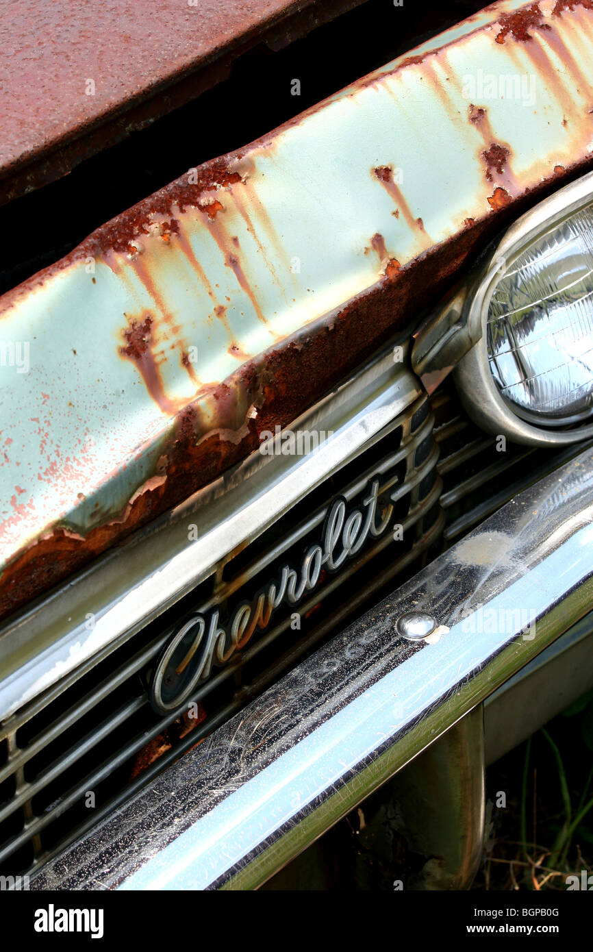 A classic Chevrolet badge rusts in an American country junk yard Stock ...
