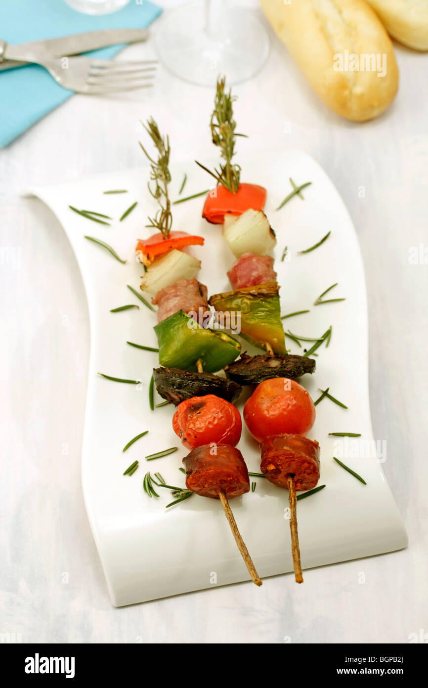Skewers with rosemary. Recipe available Stock Photo Alamy