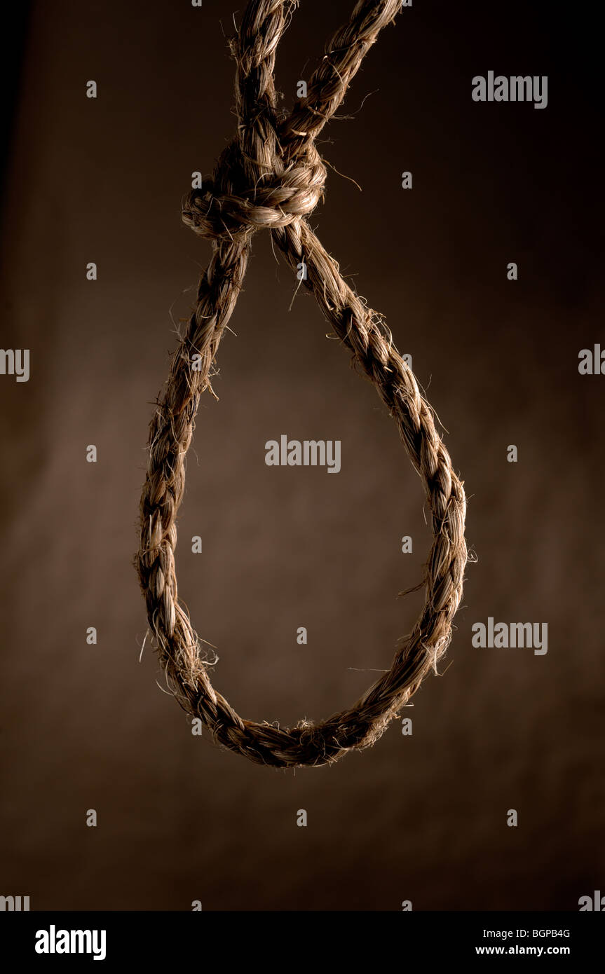 Rope in a slip knot against a textured brown background Stock Photo