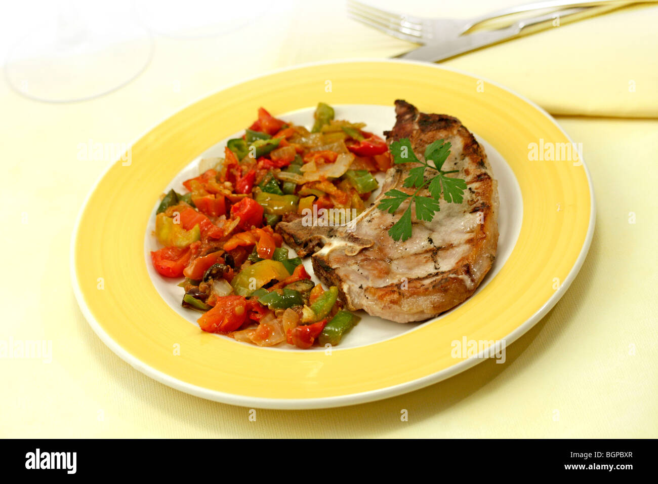 Pork chop with vegetables. Recipe available Stock Photo - Alamy