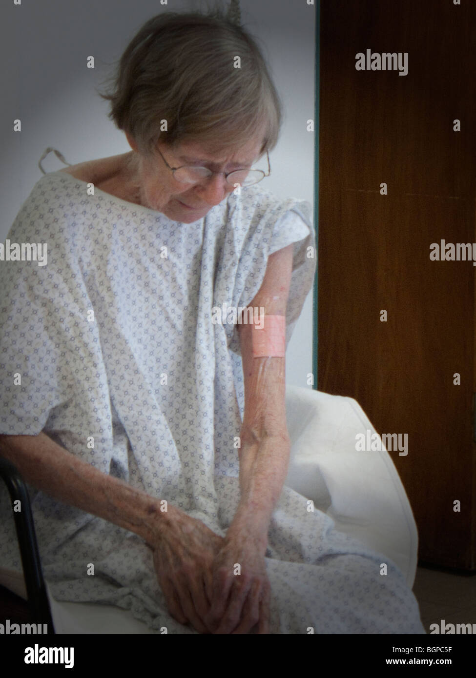 old woman resting in hospital rehab section Stock Photo