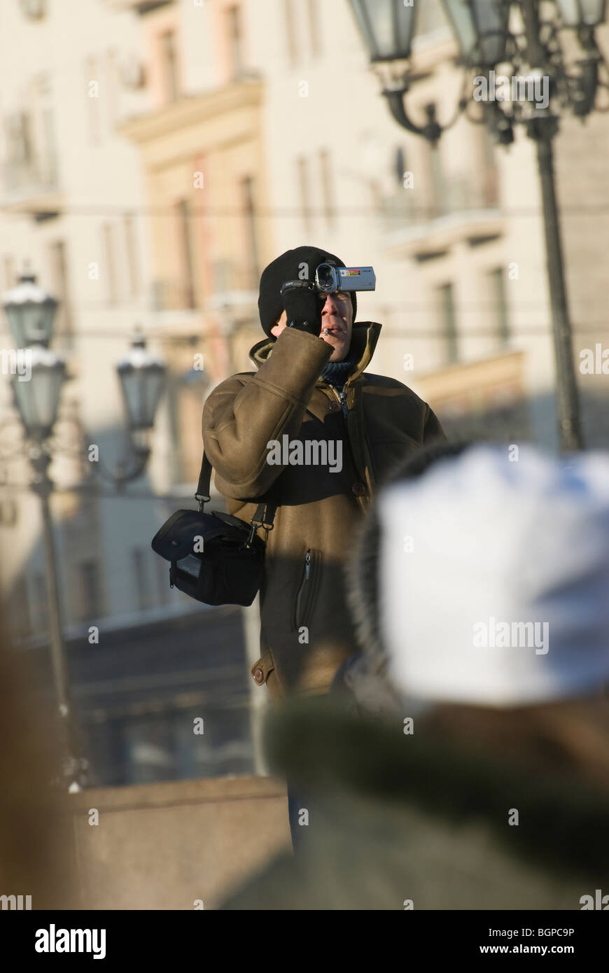 A man with compact video camera Stock Photo - Alamy