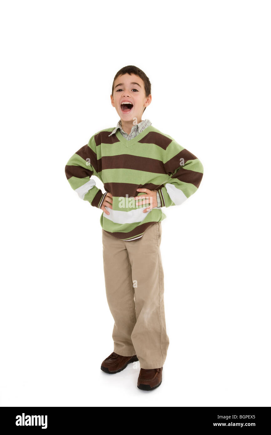 Young caucasian boy dressed in a casual outfit and standing on a white background. Stock Photo