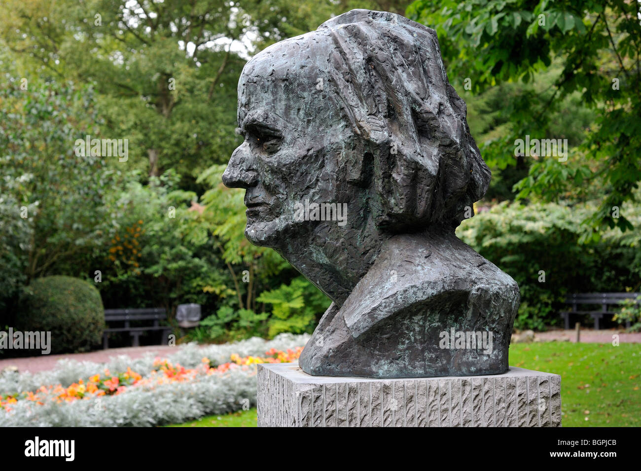 Bust of the surrealist painter Paul Delvaux in city park at Veurne / Furnes, West Flanders, Belgium Stock Photo