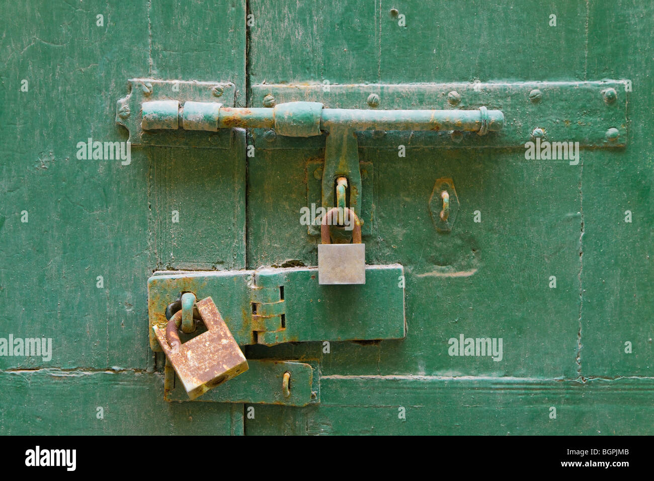 Padlocks and bolt on door Stock Photo Alamy