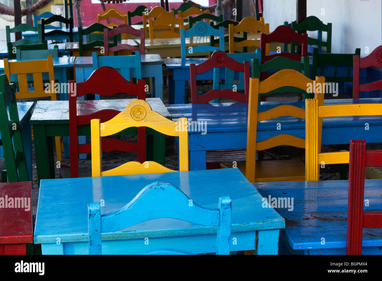 rows of colourful tables and chairs Stock Photo Alamy