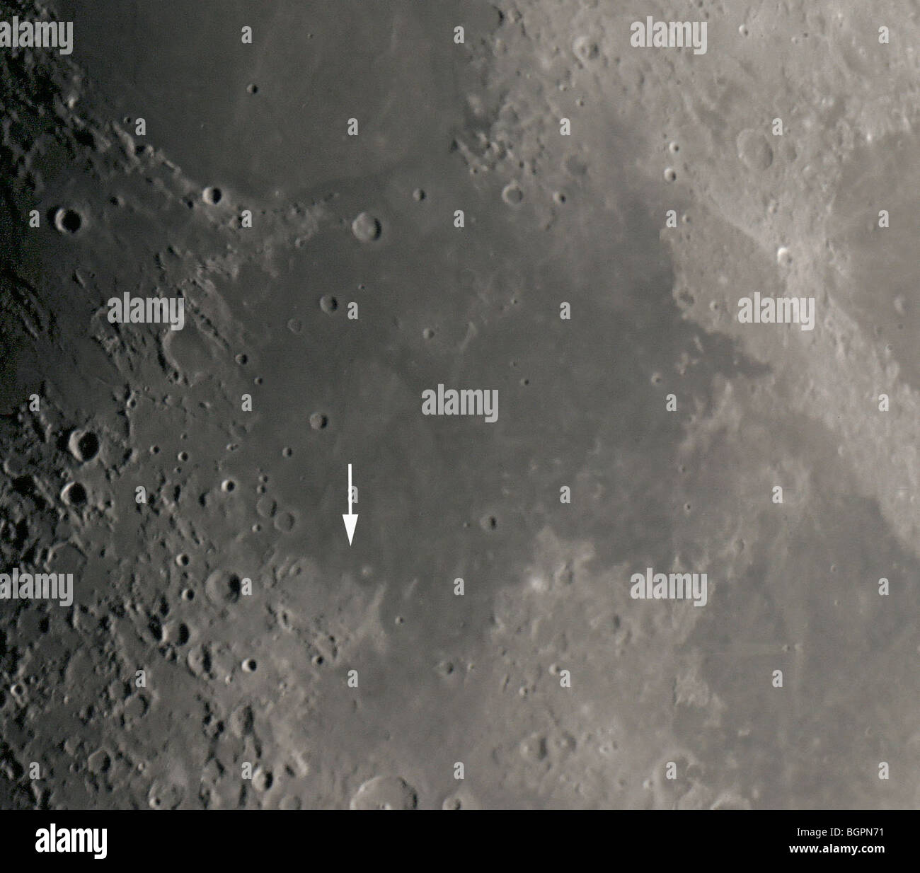 Mare Tranquillitatis. Apollo 11 landing site marked by an arrow. Stock Photo